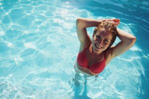 Attractive young lady in a swimming pool
