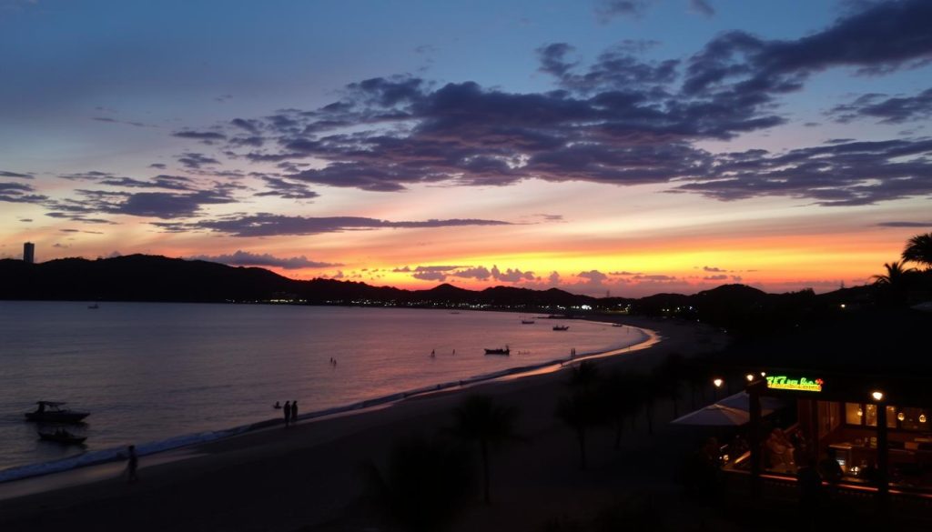 Sunset view of Kata Beach in Phuket with beach bars visible along the shoreline