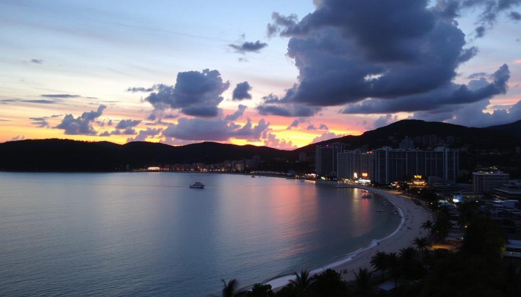Sunset view over Patong Bay with nightlife areas beginning to light up